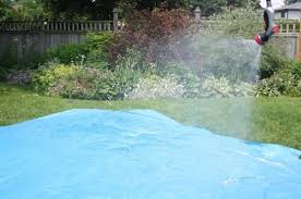 Here's a water slide to go with it! Easy Homemade Water Slide For The Backyard Happy Hooligans