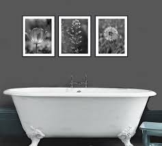 Choose designs that remind you of water droplets, or simply in the aquatic color palette of blue. Black And White Nature Photography Prints Dark Grey Wall Art Set Grey Bathroom Decor Modern Print Set 3 Botanical Pictures Vertical Art Modern Bathroom Wall Decor Grey Wall Art Gray Bathroom Decor