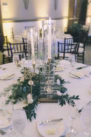 Elegant Table Centerpiece Is A Trio Of Classic Brass Candlesticks With Whi Wedding Table Decorations Wedding Table Centerpieces Candlestick Centerpiece Wedding