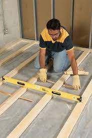 If you've noticed moisture appearing on the concrete in your basement or have some bare concrete in your home you'd like to cover easily and cheaply, vinyl plank flooring could be the thing you are looking for. How To Install Framing For Sleeper Floors Floor Insulation Floor Framing Waterproofing Basement