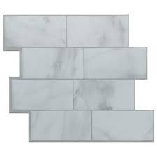 But, since penny tile doesn't really have seam lines, you don't have to worry about starting in the using a v notch trowel, put a thin layer of thinset down, then lay out a sheet of penny tile, setting it. Tack Tile Peel Stick Vinyl Backsplash At Menards Tack Tile Peel Stick Vinyl Backsplash Subway White Vinyl Backsplash Backsplash Vinyl Tiles