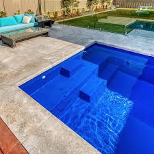 The square shape of this plunge pool echoes the geometry of this modernist home, while the concrete of the pool is a nice contrast to the warmth of the wood cladding. Small Pools Melbourne Ocean Breeze Pools Plunge Pools Melbourne