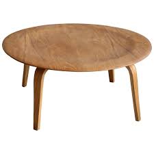 Arch features a dimpled top supported by slim legs. Early Charles Eames Herman Miller Molded Plywood Coffee Table By Evans Products At 1stdibs