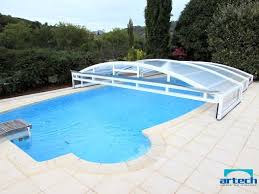 abri de piscine bas telescopique sur piscine desjoyaux ovoide america avec escalier lateral et bloc f15 installe en arie abri piscine piscine desjoyaux piscine