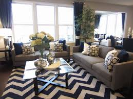 Navy blue curtains living room contemporary artwork. Grey Is The New Black In This Pulte Design Trend Tip Color Continues To Be A Driving Force In S Navy Living Rooms Living Room Design Modern Blue Living Room