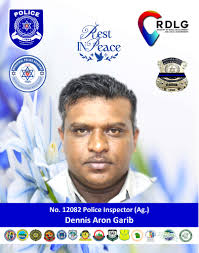 The Ministry of Rural Development and Local Government and the Trinidad and  Tobago Municipal Police Service (TTMPS) mourns the loss of Police Inspector  (Ag.) Dennis Aron Garib who died