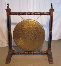 Vintage brass dinner gong with a mallet in a brass stand. A Large Arts And Crafts Oak Brass Dinner Gong Antiques Atlas