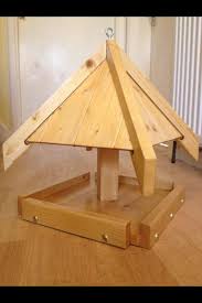 Wooden bird table topped with fresh snow. 18 Bird Tables Ideas Bird Tables Bird Bird Houses
