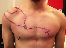 It is highly customizable and looks great on almost any body part. Rosary And Cross Tattoo On Chest