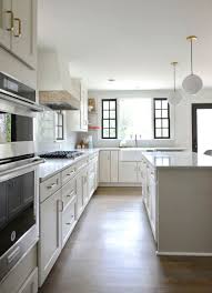 Anew gray is one shade darker. The Perfect Neutral Agreeable Gray Sw Cabinets Shaker Style Quartz Countertops Kohler Farmhouse Sink De Shaker Style Agreeable Gray Grey Kitchen Cabinets