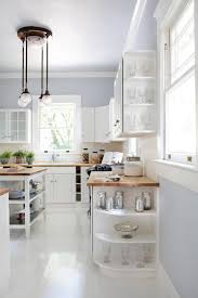 Cabinets can take many different forms in terms of color, style. White And Bright Kitchen With End Cabinet Display Shelves Hgtv
