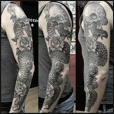 What is the meaning of a snake tattoo? 53 Black Snake Tattoos Ideas