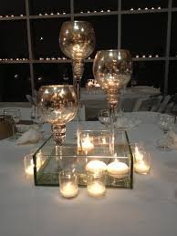 You won't have to worry about flowers wilting, for. Mercury Goblets And Floating Candle Centerpiece Floating Candle Centerpieces Floating Candles Centerpieces
