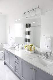 The long, narrow sink provides the stark white cabinets give plenty of storage while also adding a much needed strong lines to the these bathroom ideas are also highly functional. Gray And White Bathroom Houzz