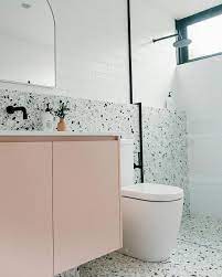 There S A Lot To Love In This Port Fairy Project From The Practicality Of The Terrazzo Tile Half Wall Millennial Pi In 2020 Reece Bathroom Pink Vanity Terrazzo Tile