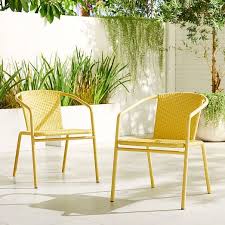 All Weather Wicker Stacking Chair Set Of 2 West Elm In 2020 Modern Outdoor Dining Lounge Chair Outdoor Outdoor Dining Chairs