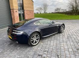 Image result for Midnight Blue 2011 Aston Martin