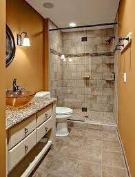 The rough brick wall and unfinished wood table of this space contrast with the smooth, geometrical look of the washbasin and mirror. 40 Beige Stone Bathroom Tiles Ideas And Pictures Small Bathroom Remodel Designs Bathroom Floor Plans Small Bathroom Remodel