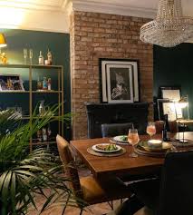Industrial Style Dining Table And Chairs In A Dramatic And Quirky Dining Room In 2020 Dining Room Teal Industrial Style Dining Table Grey Leather Dining Chair