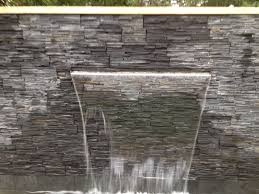 Sheer Descent Water Feature Wall With Tier Stone Cladding Pondless Water Features Water Feature Wall Garden Design Plans