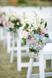 Hanging macrame curtain arches are an alternative option to fabric and work well outside, especially with some flower details. Elegant Garden Wedding Ceremony Ideas Modwedding
