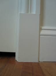 Now, what happens when that quarter round which protrudes from the vertical face of the 6 or 8 base molding hits the opening's vertical trim? Trim Terms