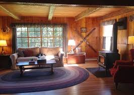 Alicia And Her Husband Restore The Knotty Pine In Their 1955 Cabin So Inviting Cabin Living Room Knotty Pine Walls Knotty Pine Living Room
