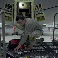 US Air Force (USAF) STAFF Sergeant (SSGT) Scott Gilkey, performs an engine  intake check