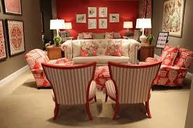 Adding pillows with bold prints and colors enhances the. Red Taupe Living Room Paint Taupe Living Room Brown Living Room Decor