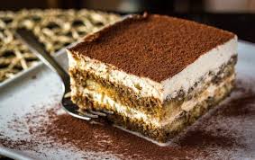 A Square Shaped Serving Of Tiramisu An Italian Dessert Made By Layering Coffee Dipped Ladyfingers With A Mascarpone C Tiramisu Recipe Homemade Cheese Desserts