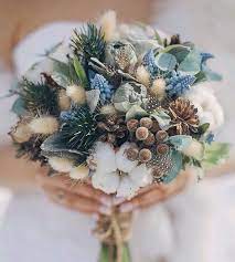 Select pure white orchids and arrange them to sit aside white pine cones, a few fluffy feathers, and several small but shiny white ornaments. 27 Cute And Budget Friendly Pinecone Wedding Ideas Weddingomania