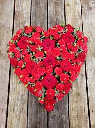 They stand tall and are easy to see. Rose Carnation Heart Flower La Vita Florist Funeral Flowers Torbay