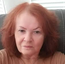 What is the vintage Christmas figurine supposed to be holding?