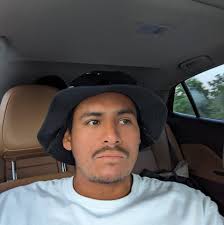 What is causing the water stains behind the siding of this house?