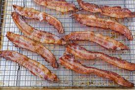 Learn to bake perfect crispy and delicious bacon in the oven with no splatter mess to clean up. How To Cook Bacon In The Oven No Mess Lil Luna