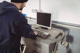 It is an ideal option if you are looking to produce high quality garage working drawings. Mechanic Working On Personal Computer In Repair Garage Checking Man Stock Photo 225324528