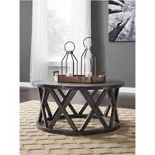 If you want to add rustic flair to your seating arrangement, roll with the casual style and flexibility of the rogness round coffee table. T711 8 Ashley Furniture Sharzane Living Room Round Cocktail Table