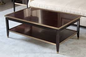 Clean lines and neutral black metal legs make it endlessly versatile. Dark Wood Coffee Table With Gold Accents