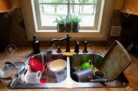 stack of dirty dishes piled into the