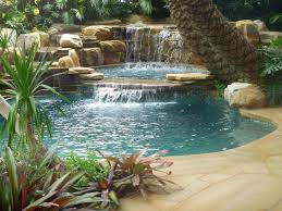 And if you have a large concrete deck that this may not be feasible around the entire pool either, but you could put trellises up on one or two sides, and train some type of vine to climb them. Tropical Backyard Pool Waterfall Into Jacuzzi Tropical Pool Miami By Matthew Giampietro Garden Design Houzz