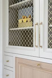 Shop our selection of different size storage cabinets with doors or drawers. Built In Office Cabinets With Metal Lattice Doors Transitional Den Library Office