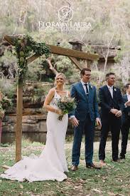 Jj's house offers tons of affordable wedding flowers and wedding bouquets in a variety of materials, such as silk wedding flowers and satin ones. Flora By Laura Arbour Flowers Australian Natives Outline This Arbour So Beautifully What A Serene Setting Wedding Arbour Wedding Bouquet Arrangements Wedding