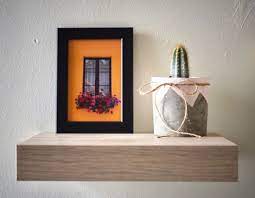 شباك صغير بغرفة القعدة مثلا القياسات المتوفرة a4 18 13 10 15 frames window homedecor art simplicity photography floating shelves decor home decor