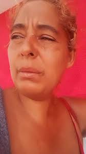 Close-Up of Arm Holding a Currency Note