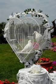 A Beautiful Wedding Display The Heart Shaped Baskets Hold The Doves Ready For Release Wedding Doves White Doves Bird Wedding