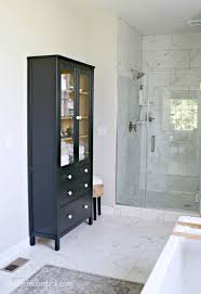 Shelf unit with glass door. Hemnes Glass Cabinet Makeover In Bathroom Thrifty Decor Chick Thrifty Diy Decor And Organizing