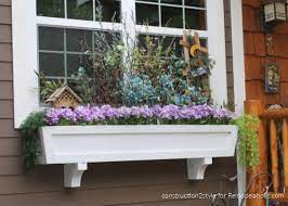 They don't look like much right now, but once they grow and fill in but look at what a difference it makes just adding the window box, pulling weeds and filling the flower beds with fresh bark… Remodelaholic How To Build A Window Box Planter In 5 Steps
