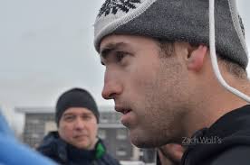 NHL players gather atop parking garage for impromptu hockey game with fans 