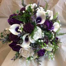 The wedding is a lavish affair, but ends in disarray when joffrey dies after drinking poisoned wine. A Wedding Bouquet Of White And Purple Silk Flowers Purple Wedding Flowers Purple Wedding Bouquets Purple Calla Lilies