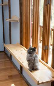 Adding A Large Window Perch Provides Plenty Of Room For Cats To Enjoy The View Cat Furniture Diy Cat Perch Diy Cat Window Perch